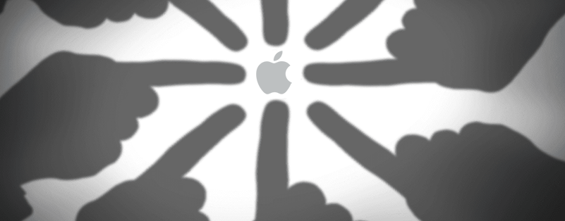 Fingers pointing at Apple logo